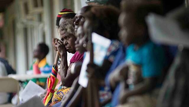 ARAWA, Autonomous Region of Bougainville, Papua New Guinea (June 30, 2015) A woman waits her turn at the Pacific Partnership community health engagement in Arawa, Papua New Guinea. The hospital ship USNS Mercy (T-AH 19) is in Papua New Guinea for its second mission port of PP15. Pacific Partnership is in its tenth iteration and is the largest annual multilateral humanitarian assistance and disaster relief preparedness mission conducted in the Indo-Asia-Pacific region. While training for crisis conditions, Pacific Partnership missions to date have provided real world medical care to approximately 270,000 patients and veterinary services to more than 38,000 animals. Critical infrastructure development has been supported in host nations during more than 180 engineering projects. (U.S. Navy photo by Chief Mass Communication Specialist Greg Badger/Released)