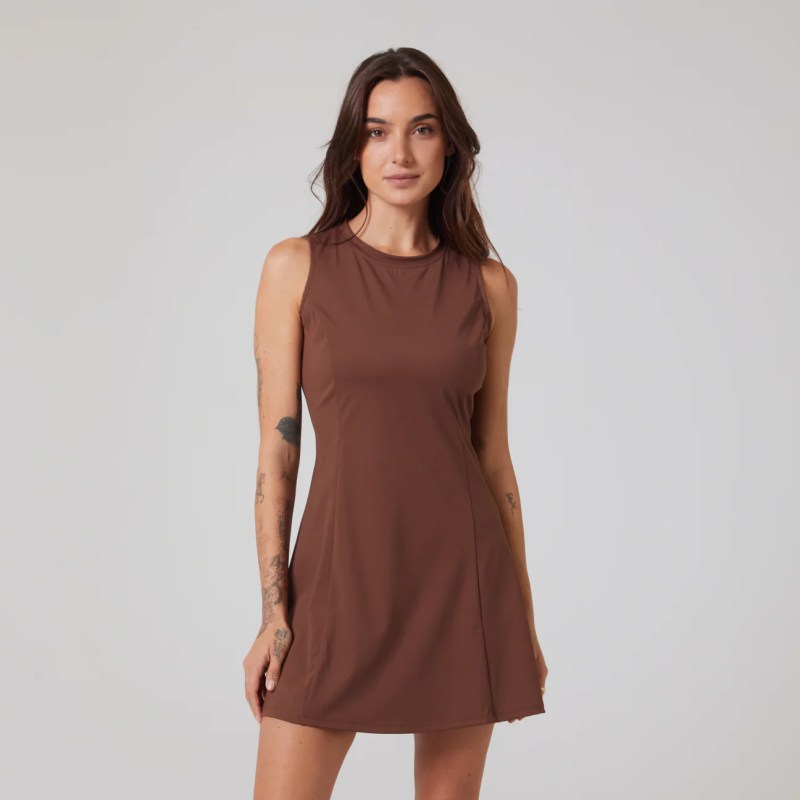 Woman in brown pickleball dress from Stack Athletics