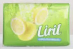 Displays a soap called Liril which has lemon slices falling in water.