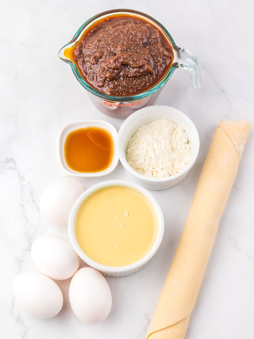 an overhead image showing the measured ingredients needed to make a homemade apple butter pie