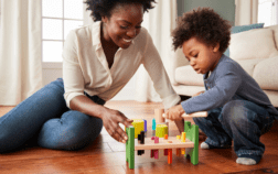 Child playing with caregiver with toy during DIR Floortime.
