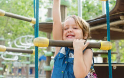 Girl developing dexterity at playground