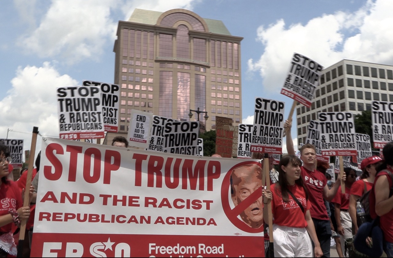 Dozens of members of the Freedom Road Socialist Organization join a protest march in downtown Milwaukee, WI, on Monday, July 15, as the 2024 Republican National Convention begins. Protestors hold signs with slogans such as "Stop Trump and the racist Republican agenda." Photo by Stephen Janis.