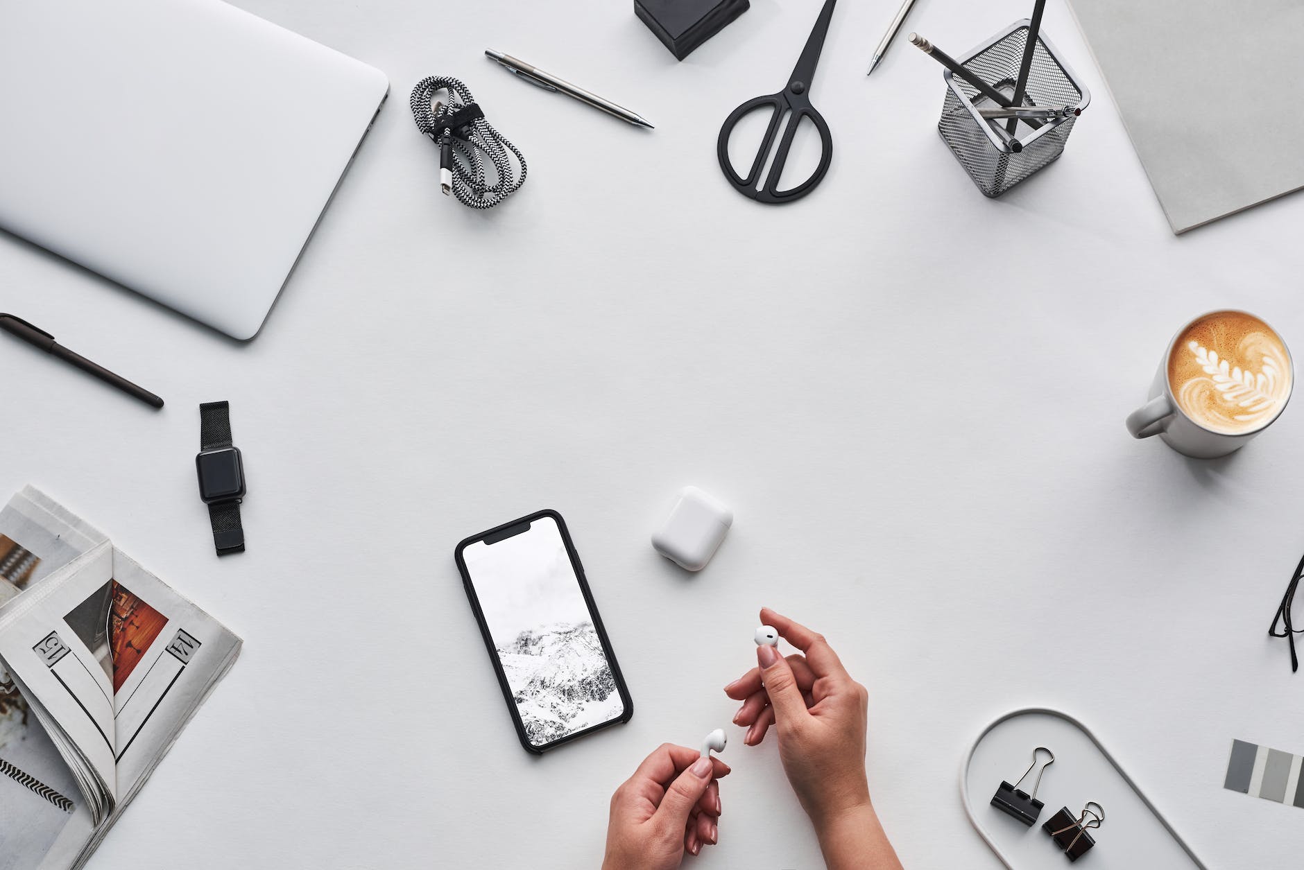 top view photo of person holding earphones