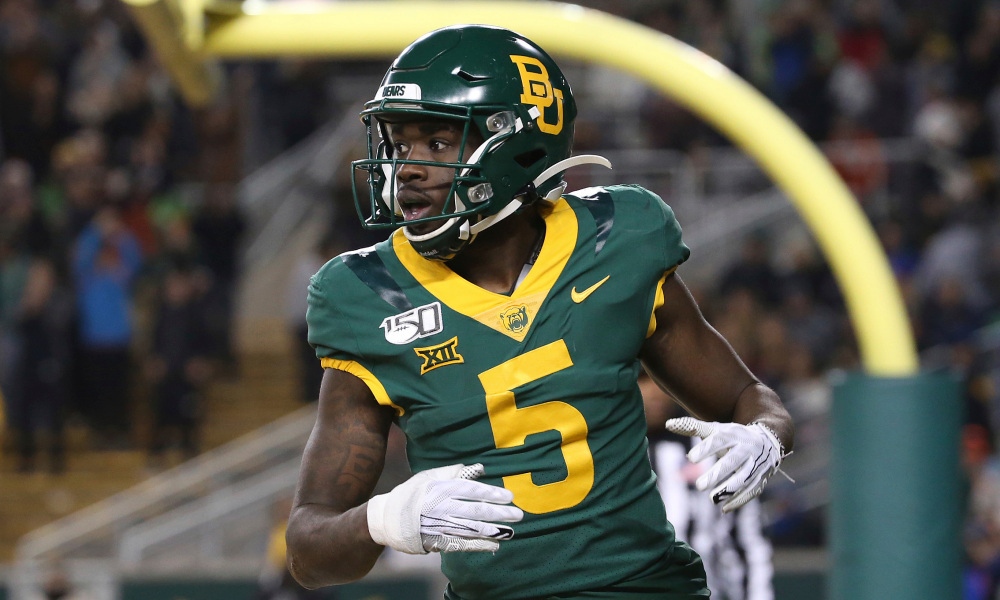 Baylor wide receiver Denzel Mims (5) looks over to the side line after a touchdown in an NCAA college football game against West Virginia in Waco, Texas, Thursday, Oct. 31, 2019. (AP Photo/Jerry Larson)