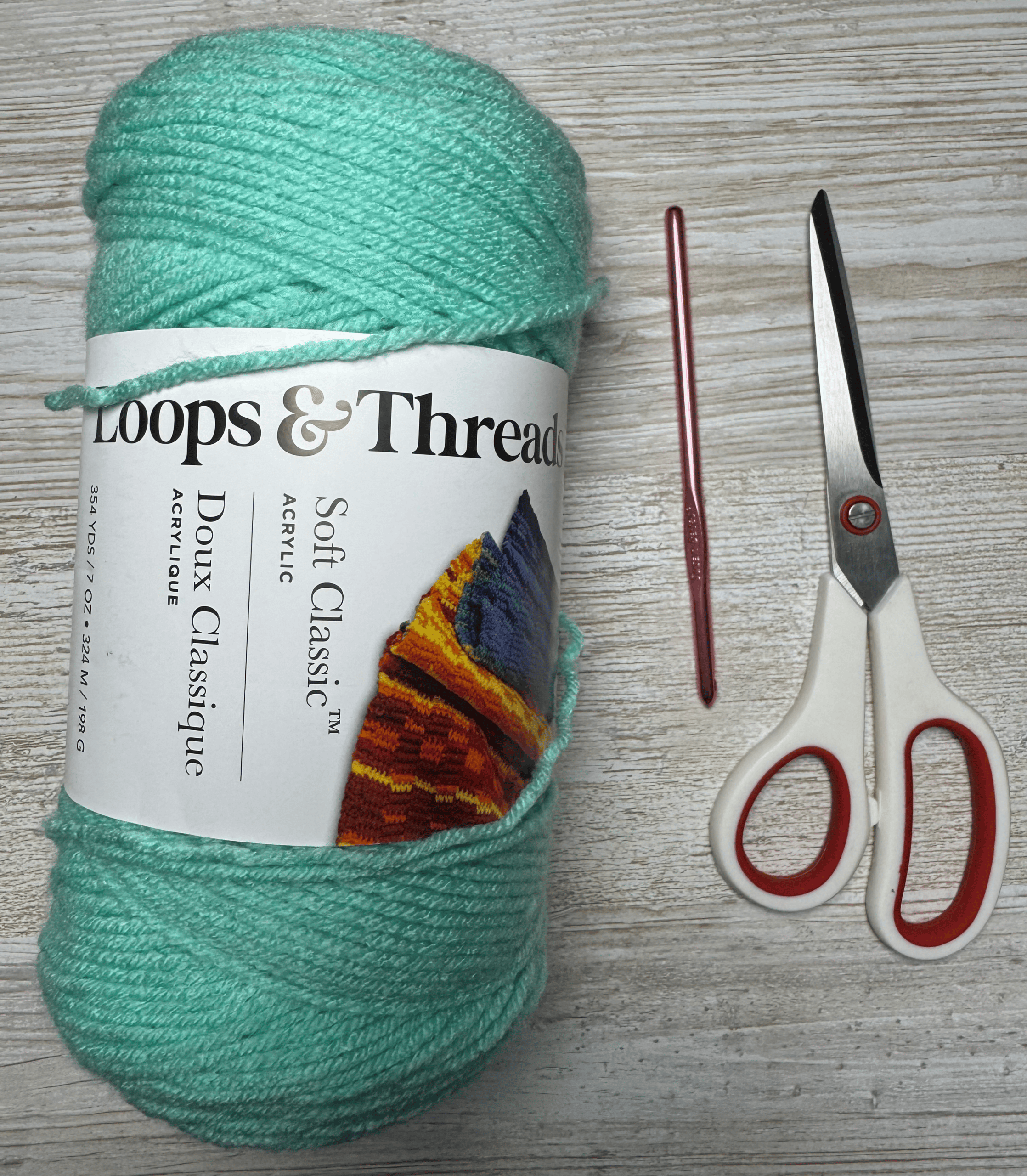materials needed to learn the moss stitch are yarn, a hook and scissors
