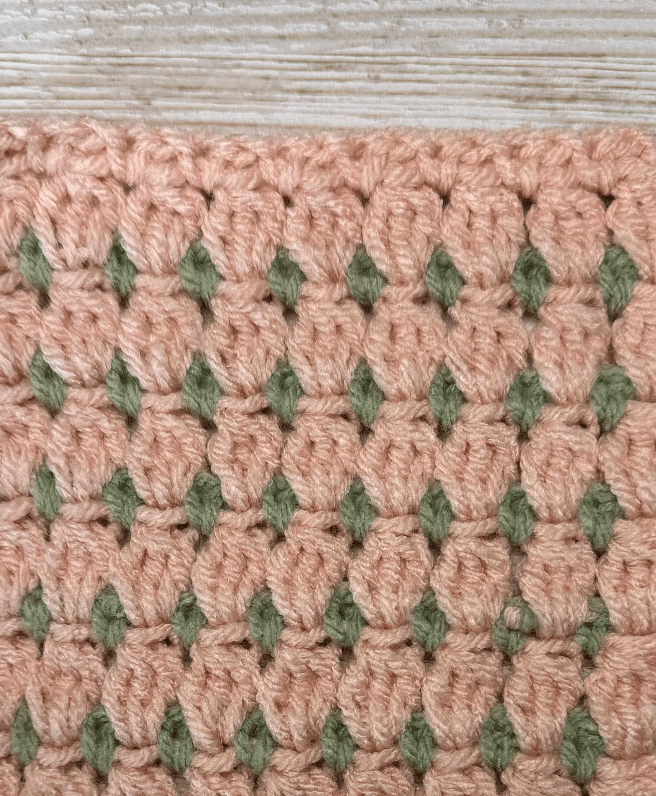 Completed swatch of the 3 double crochet cluster stitch.