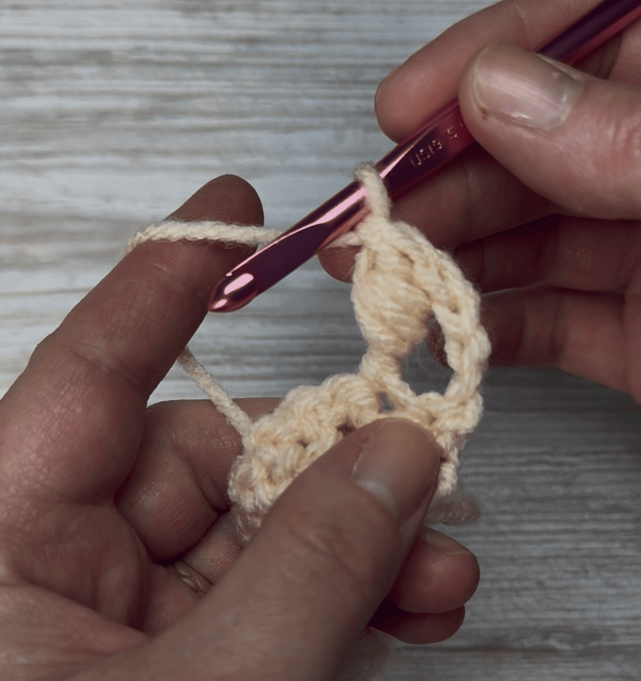 Yarn over and pull through last 2 loops to complete the bead stitch.