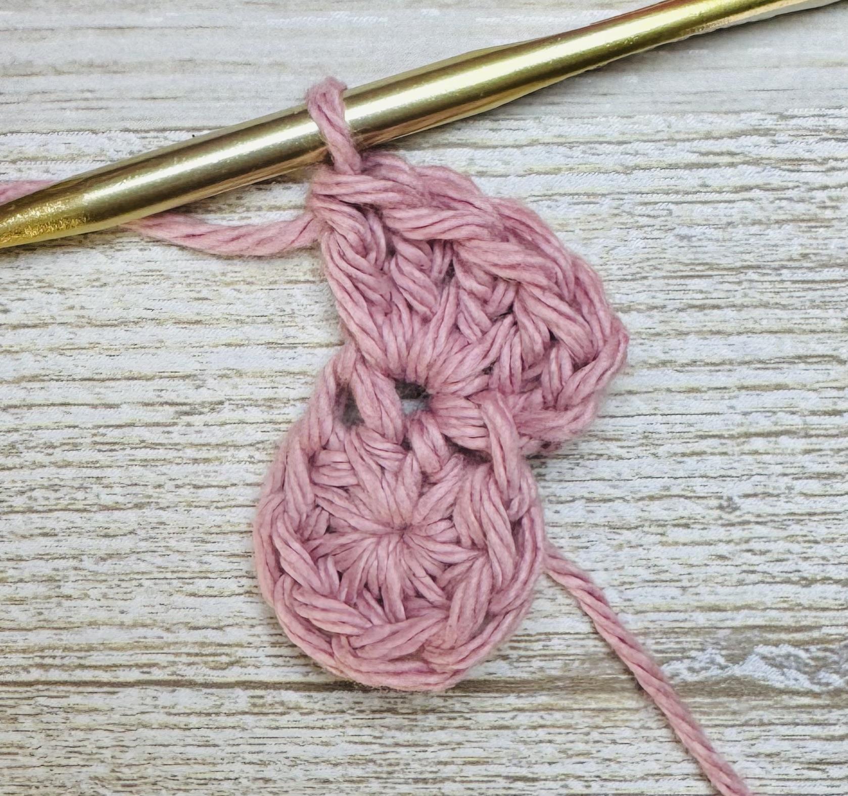 To create the first popcorn stitch petal, ch 3 and 4 DC in same stitch.