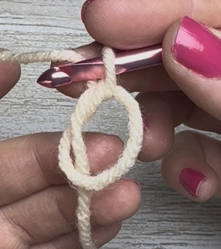 To begin crocheting in the round, make a magic circle.