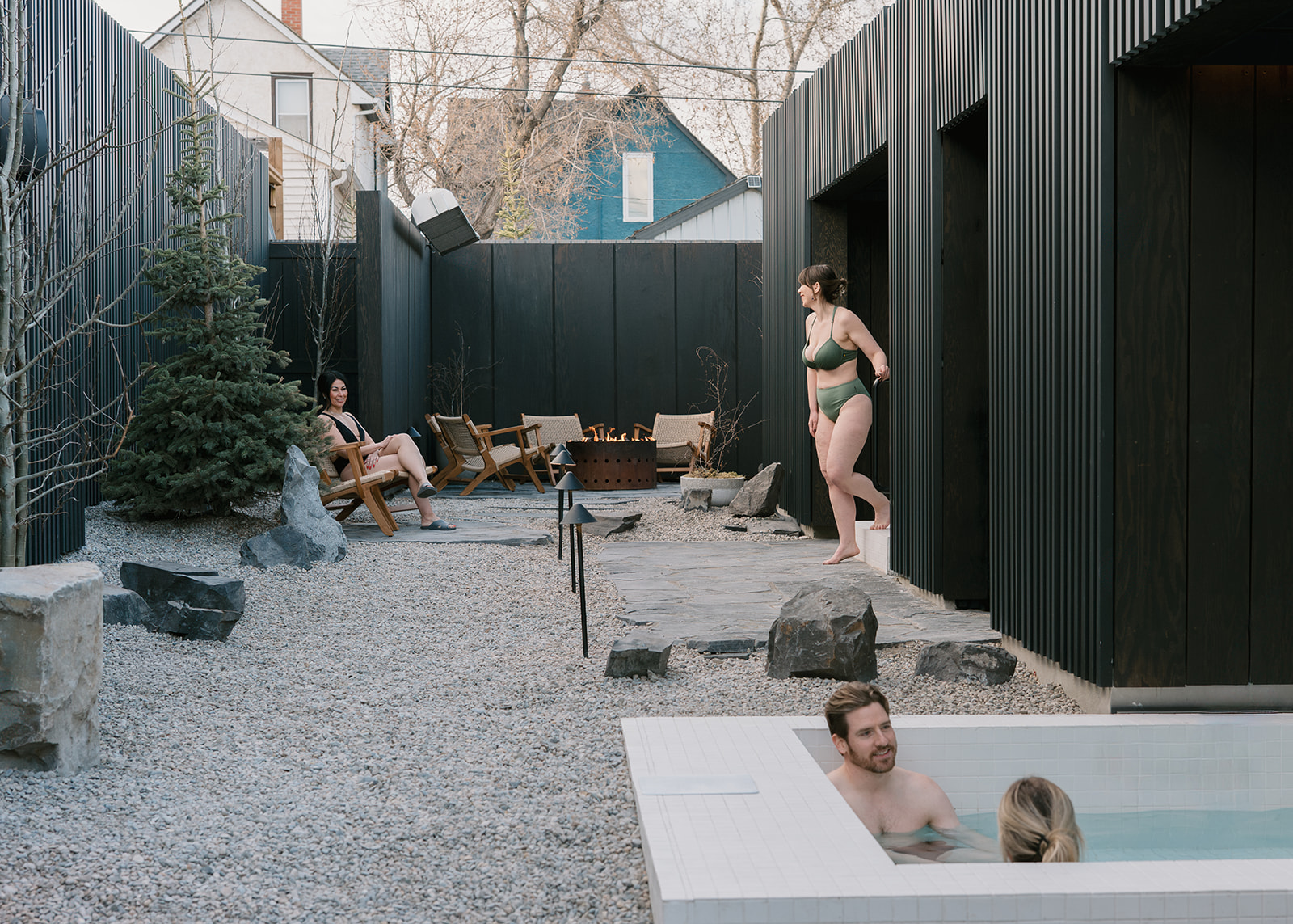 people enjoying an outdoor hydrotherapy spa