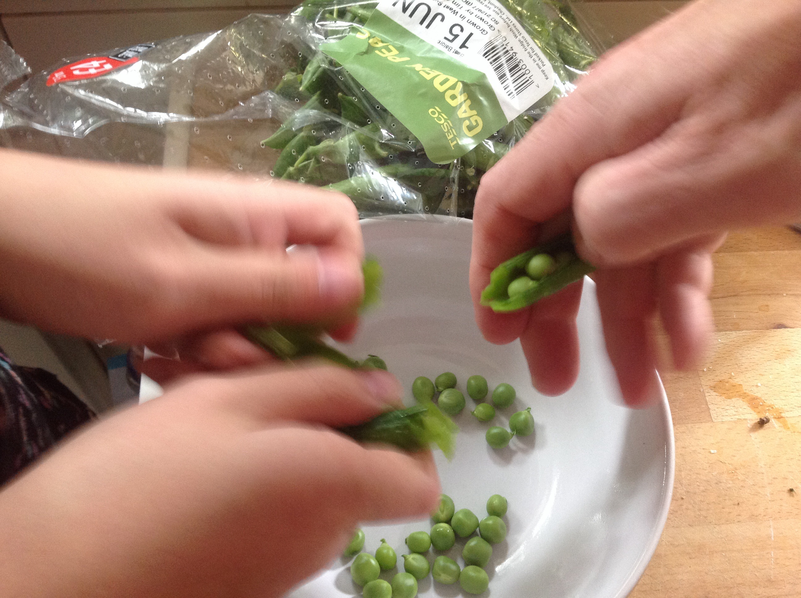 Shelling the garden peas