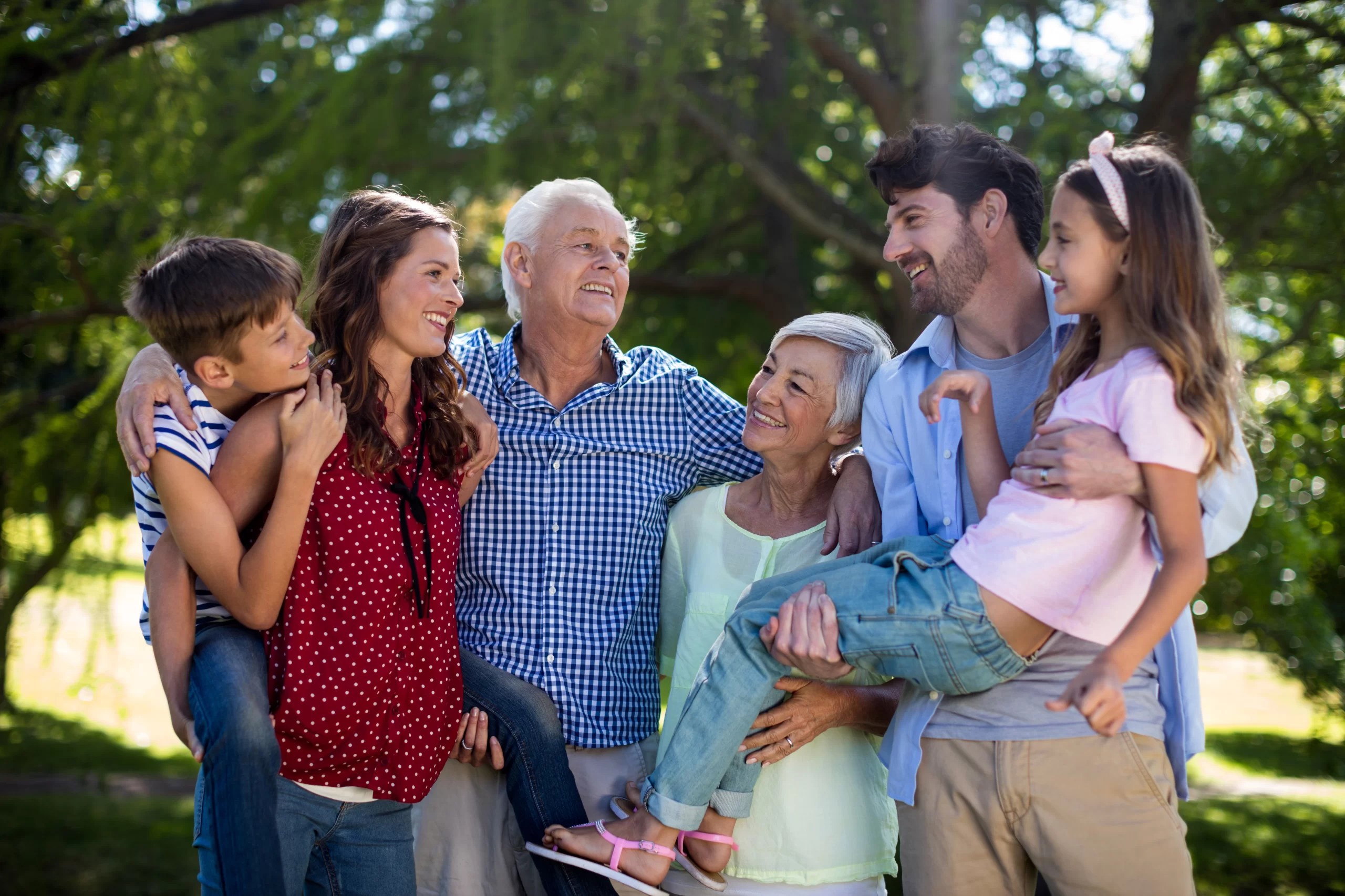 family with grandparents in park