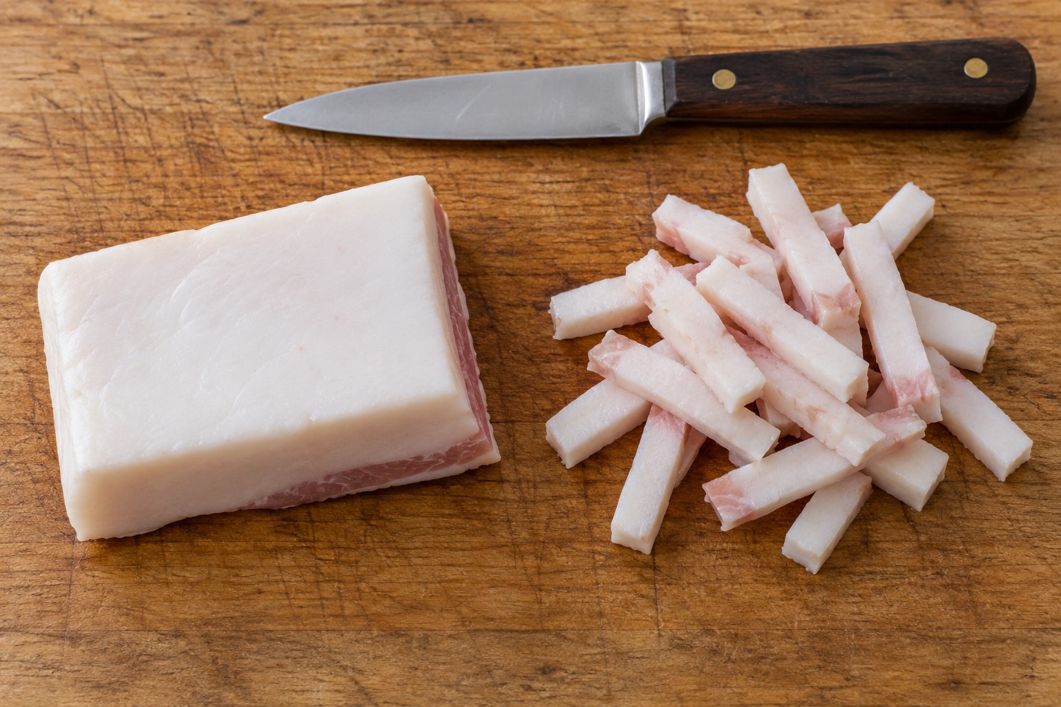 Pork fatback cut into short strips called lardons