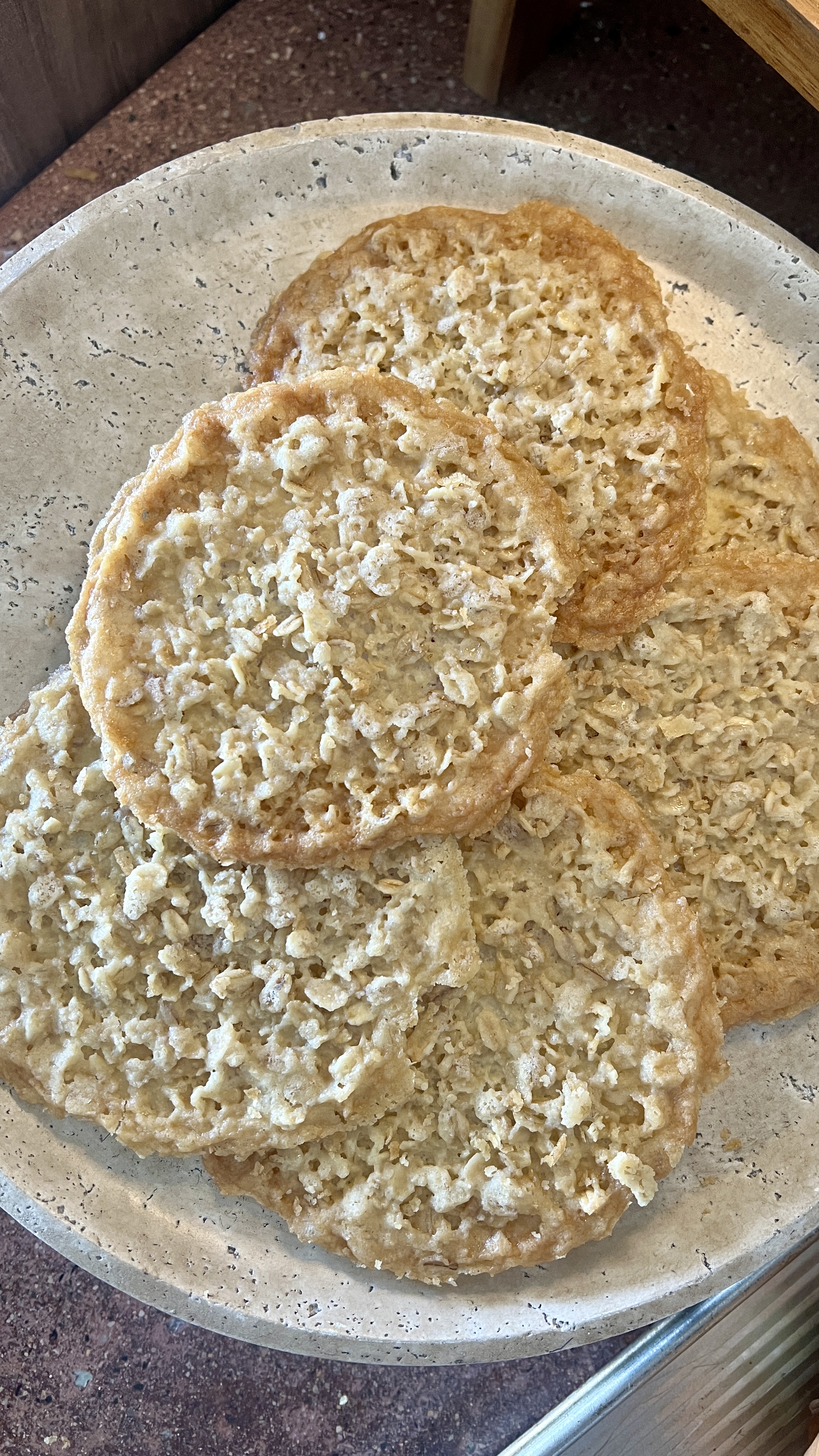 thin oatmeal cookies on a serving tray