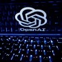 OpenAI logo on illuminated laptop