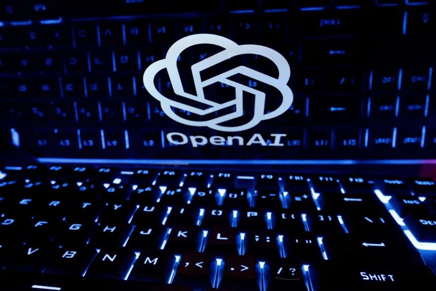OpenAI logo on illuminated laptop
