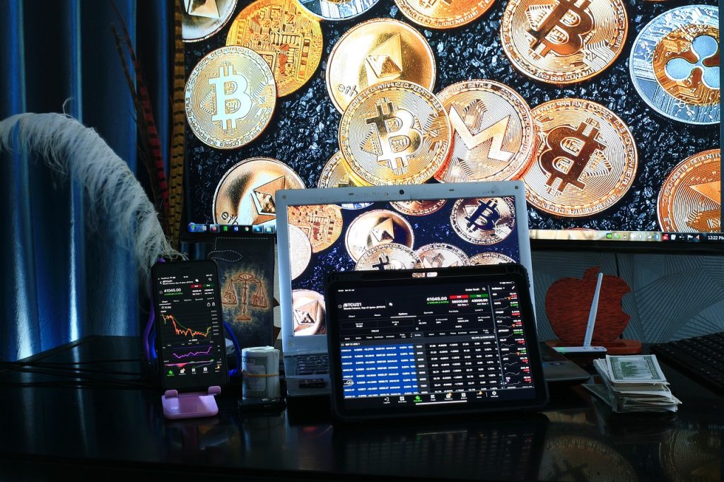 laptop with crypto coins