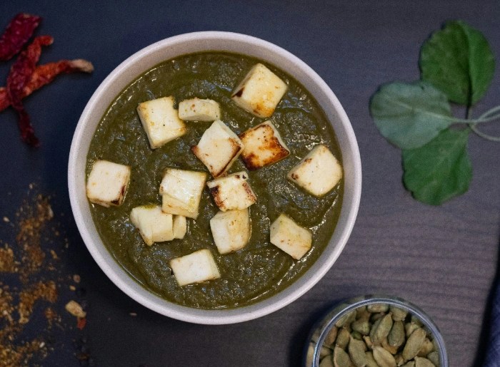 Paneer served in a green gravy