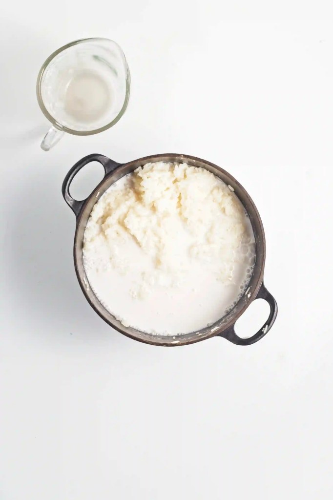 sticky rice soaking in water with coconut sauce