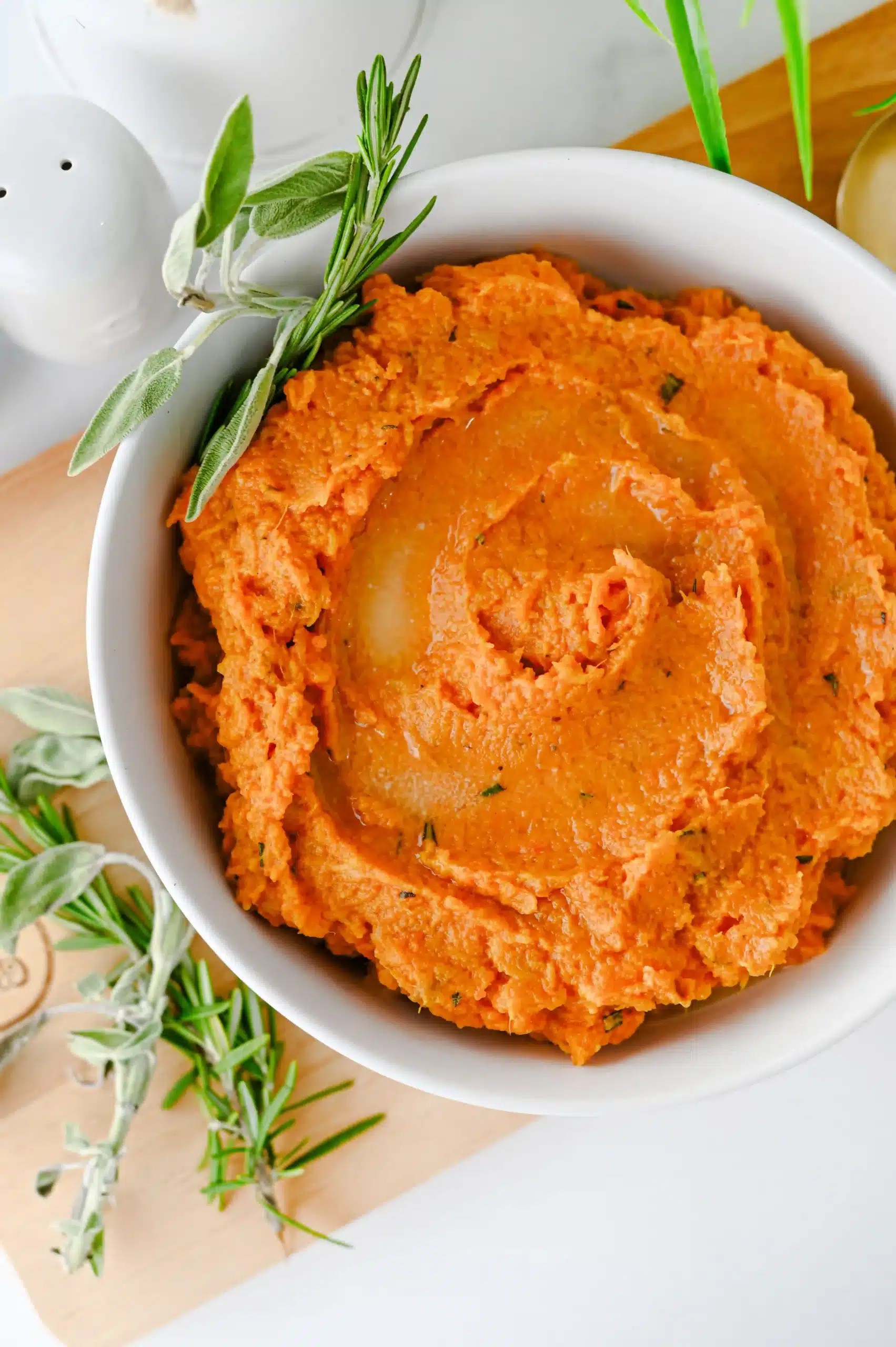 mashed sweet potatoes with spices in a white bowl