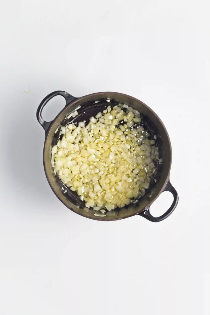 onion and garlic cooking in a pan
