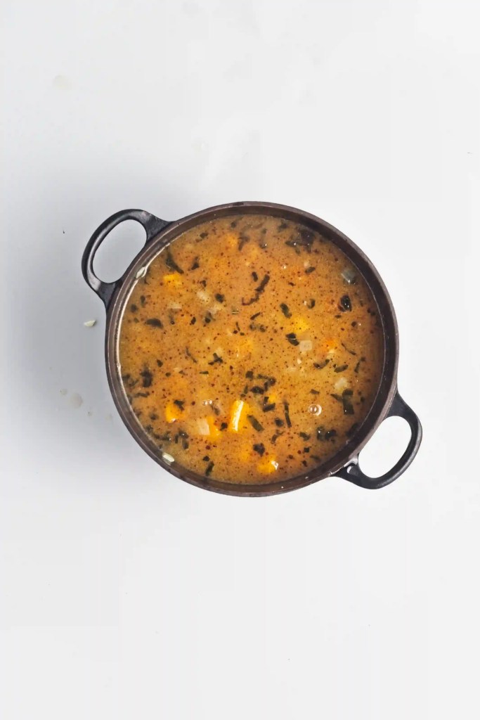 butternut risotto in a black pot