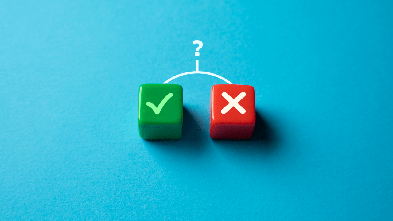 Two dice with check mark and cross symbols against a blue background, symbolizing the decision-making process and the theme of acceptance and rejection discussed in the blog post.