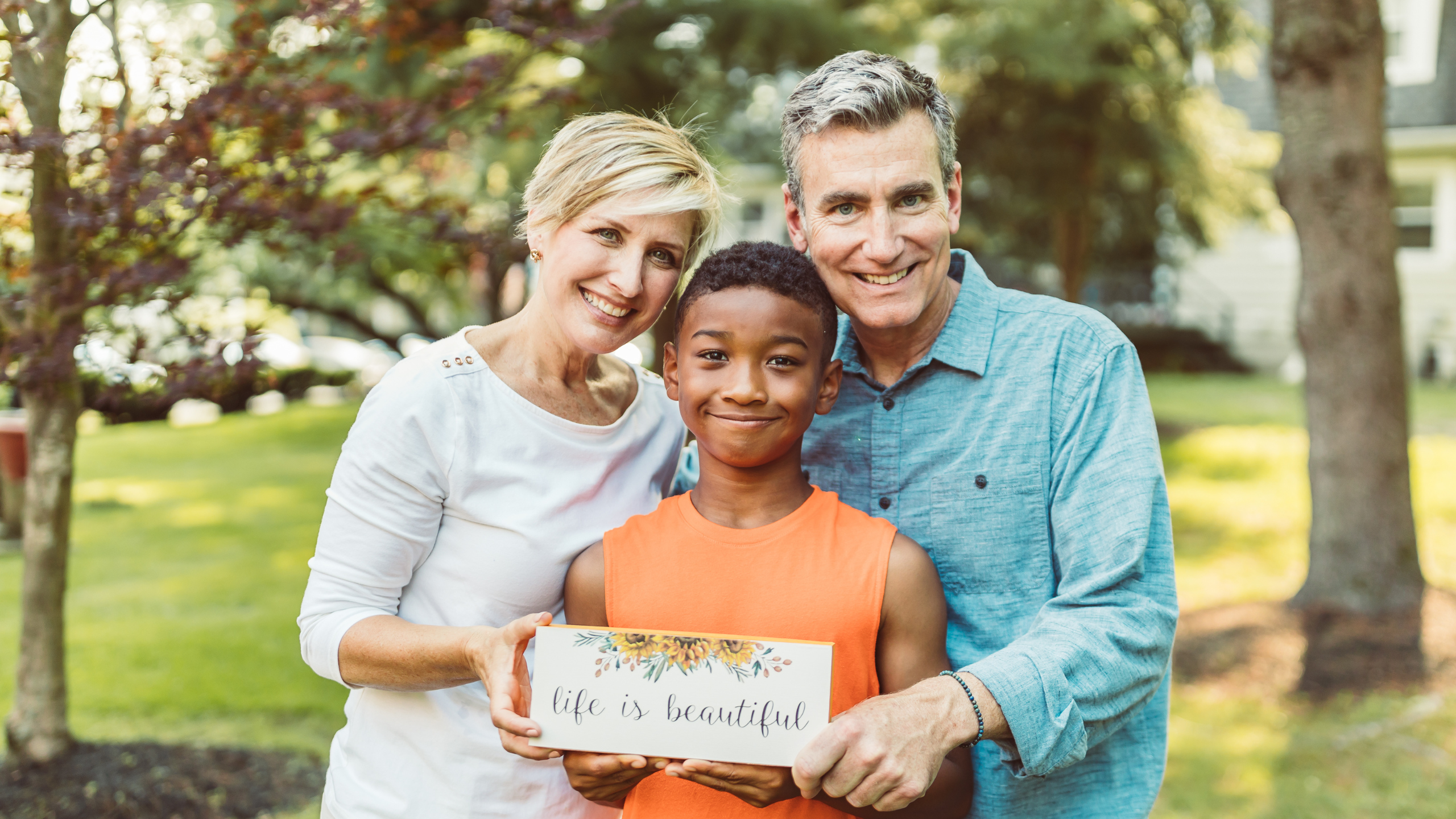 Two white adoptive parents of black child