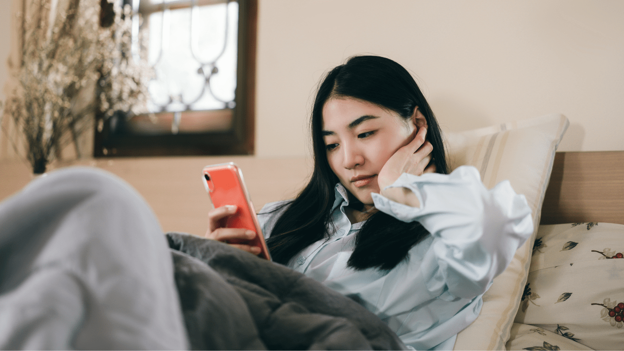 Young adult woman using smartphone.