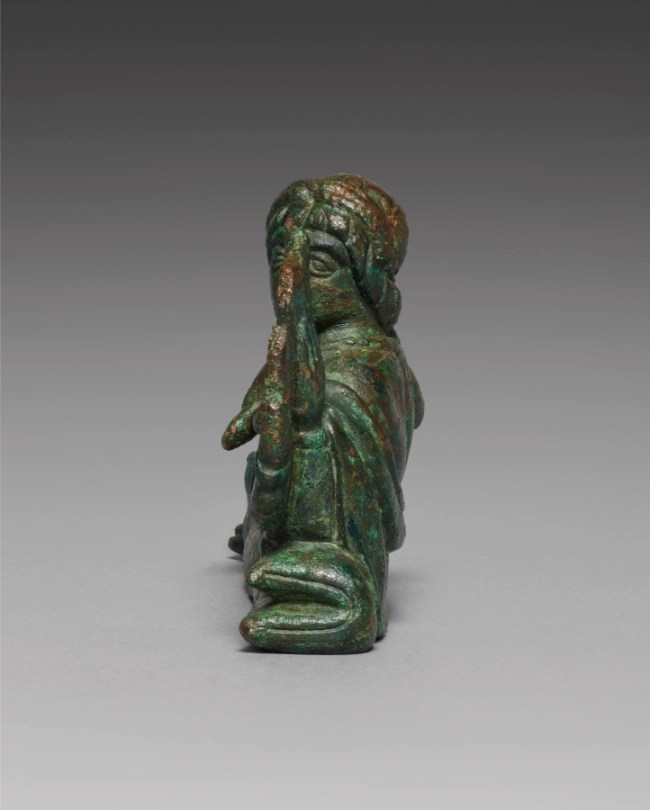 Vessel Ornament of Lyre Player, side view showing figure profile
