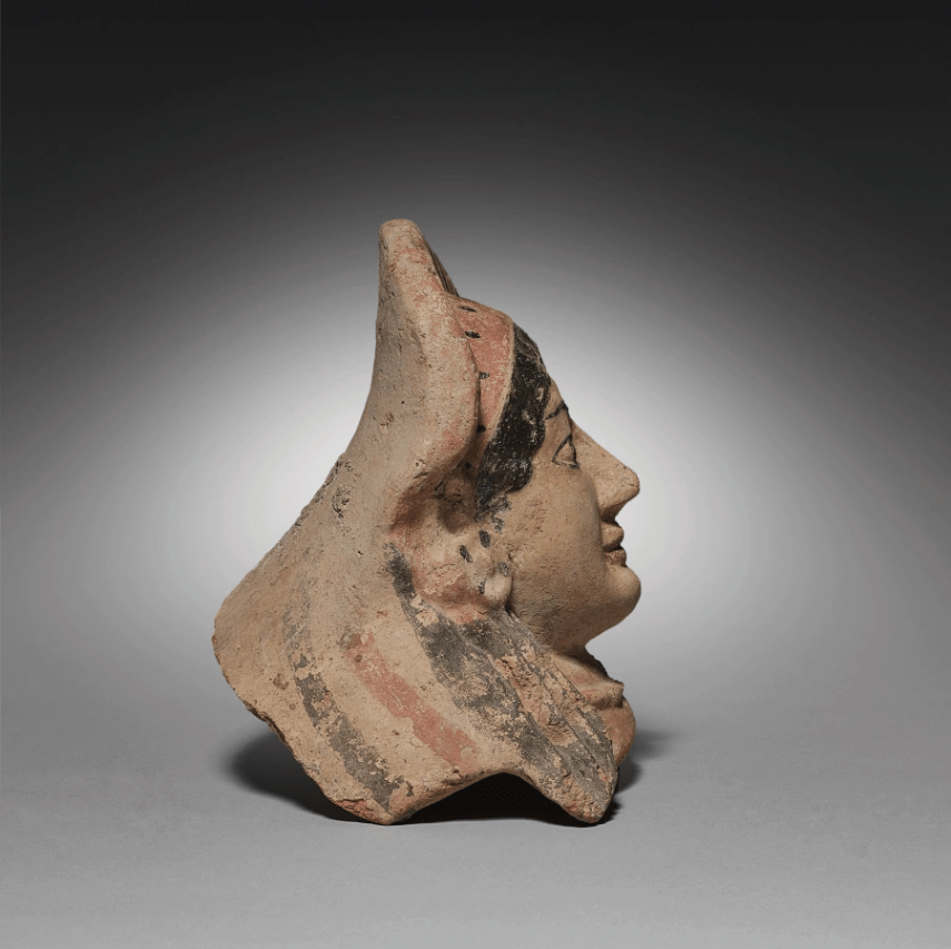 Etruscan Antefix, side view showing roof-tile cap profile
