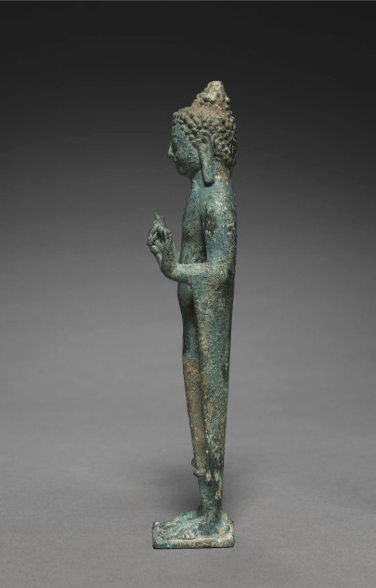 Teaching Buddha sculpture, side view showing seated posture and drapery

