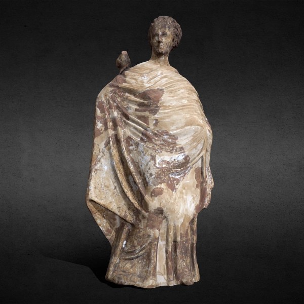 Ancient painted terracotta statue of a standing woman holding a bird on her shoulder