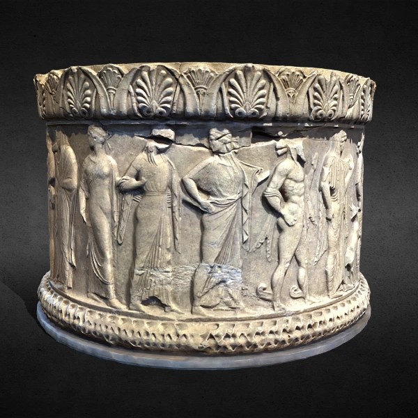 Ancient cylindrical marble artifact with carved reliefs of human figures in classical attire and decorative floral motifs around the top and base