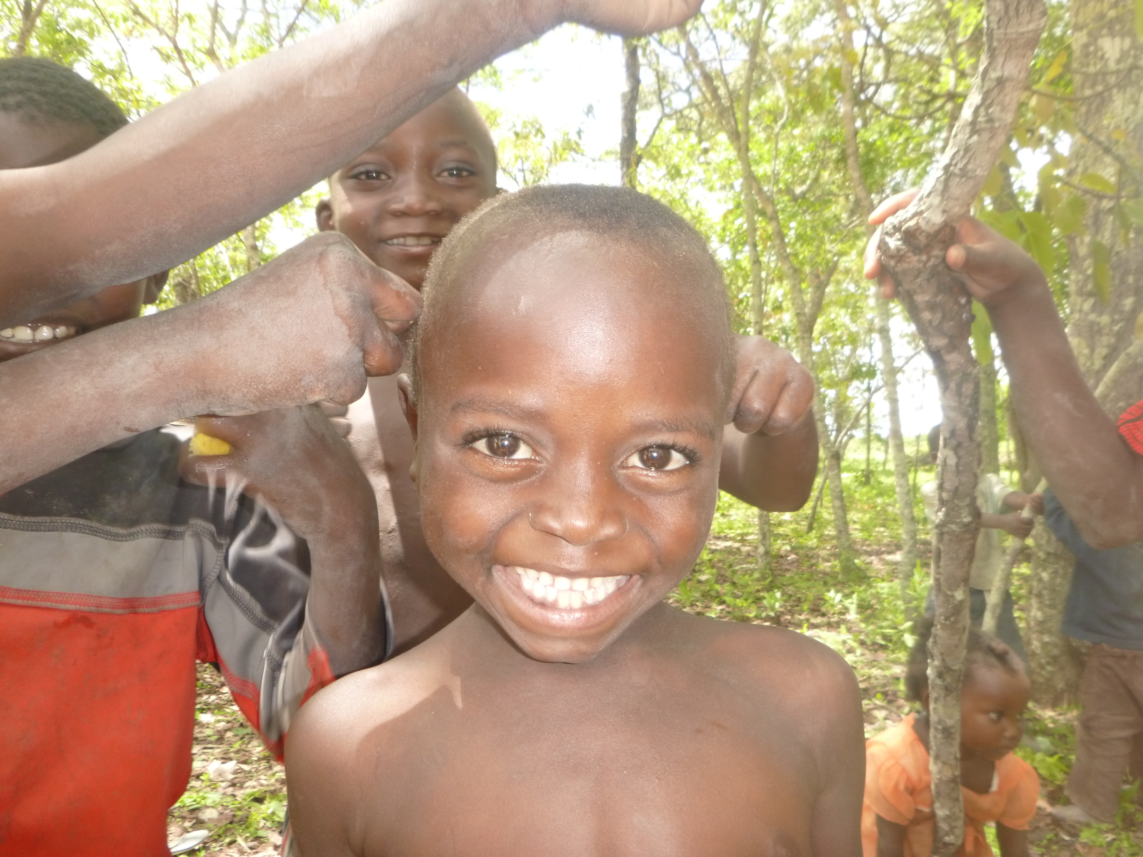 Kamfwa, surrounded by friends.