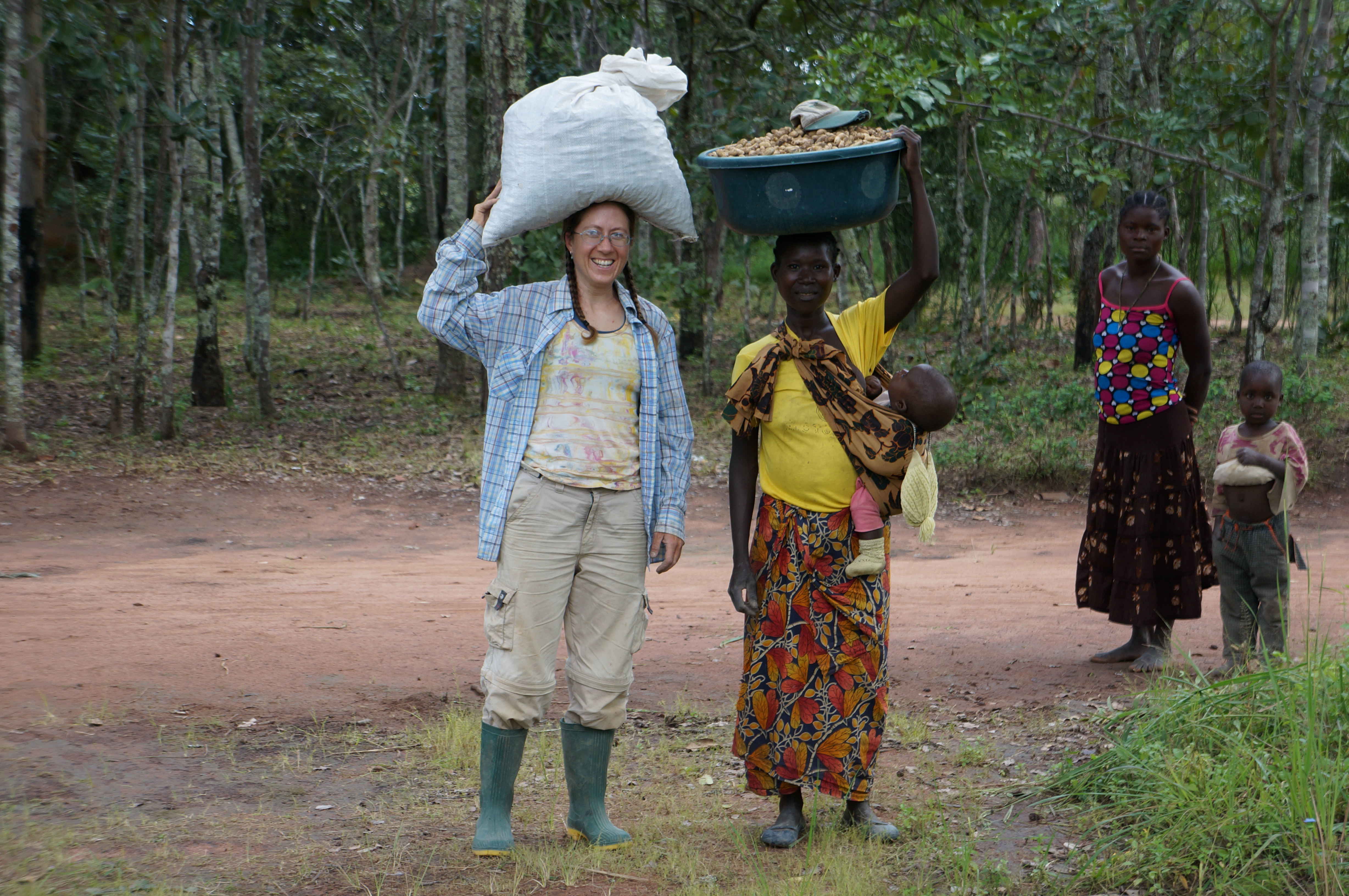 Me and Ba Lister carrying groundnuts from my field.