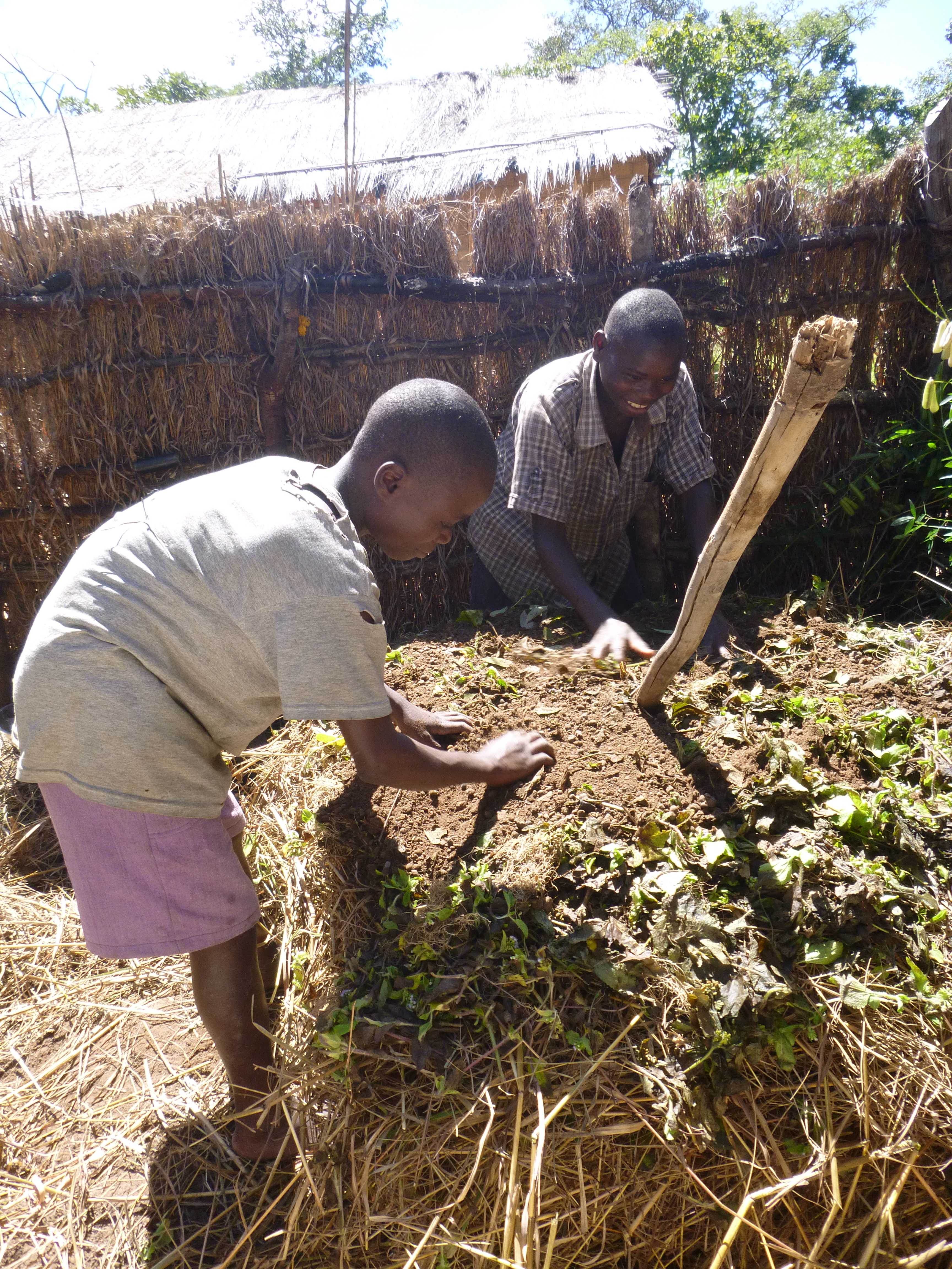 Bwalya and Boyd making compost.