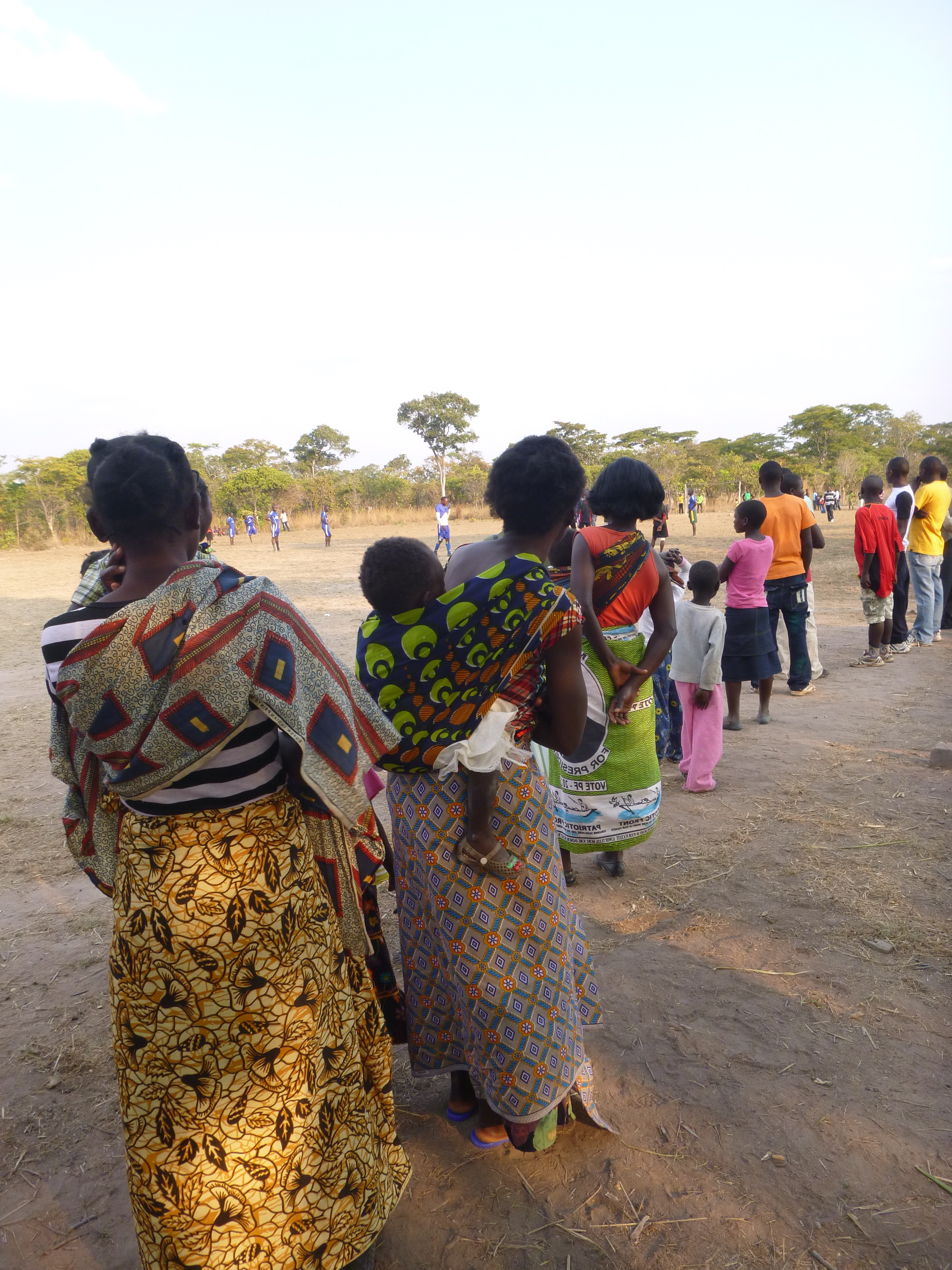 Watching the Mfuba vs. Mumana Lupanda bola (football) game.