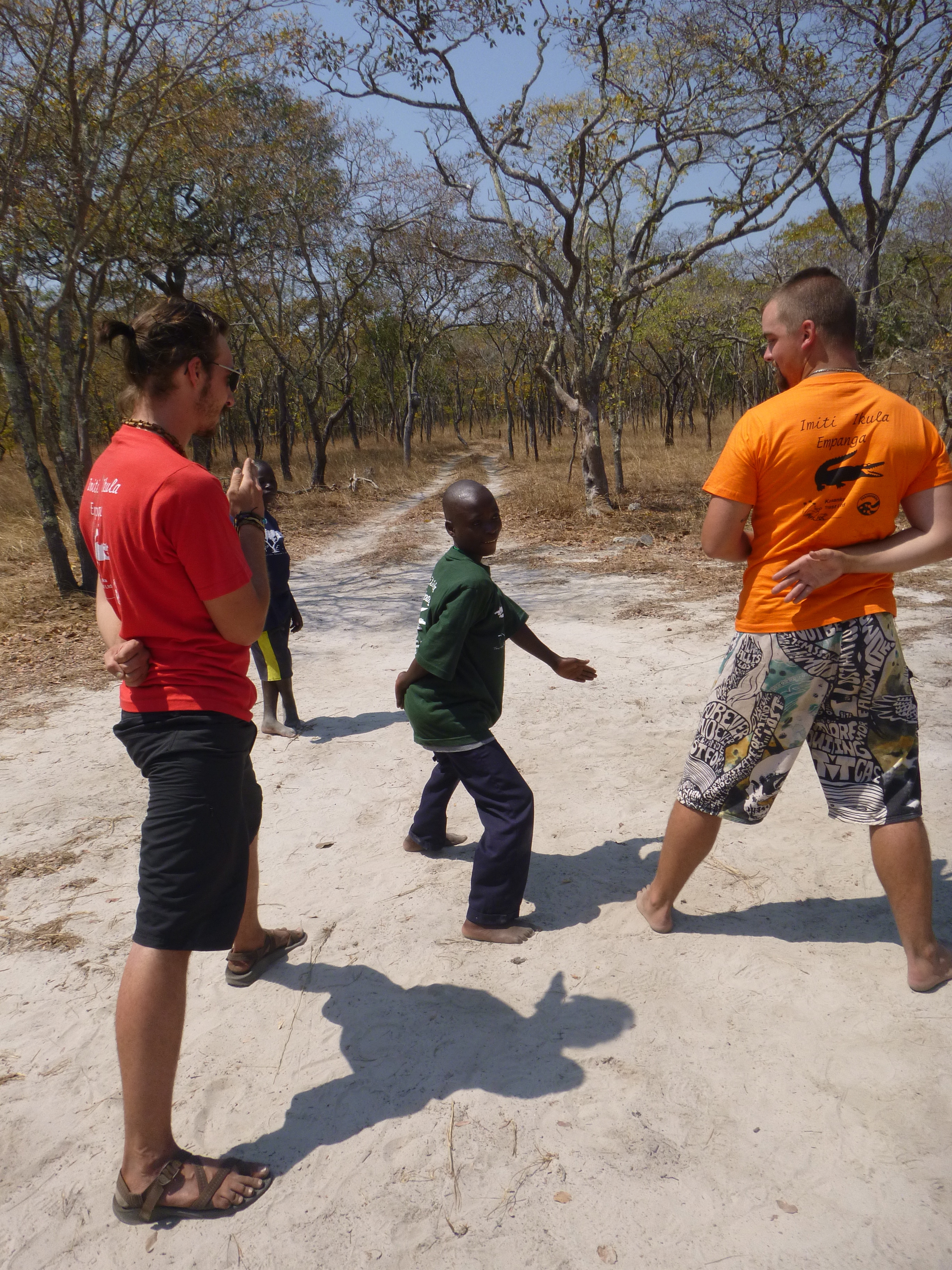 Stephen is clearly outmatched by giant PCVs Scott (left) and Cody, but he participated eagerly in every game and activity - and held his own.