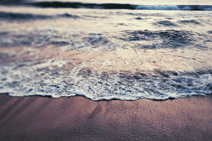 Beach waves captured at sunrise female Travel blog india