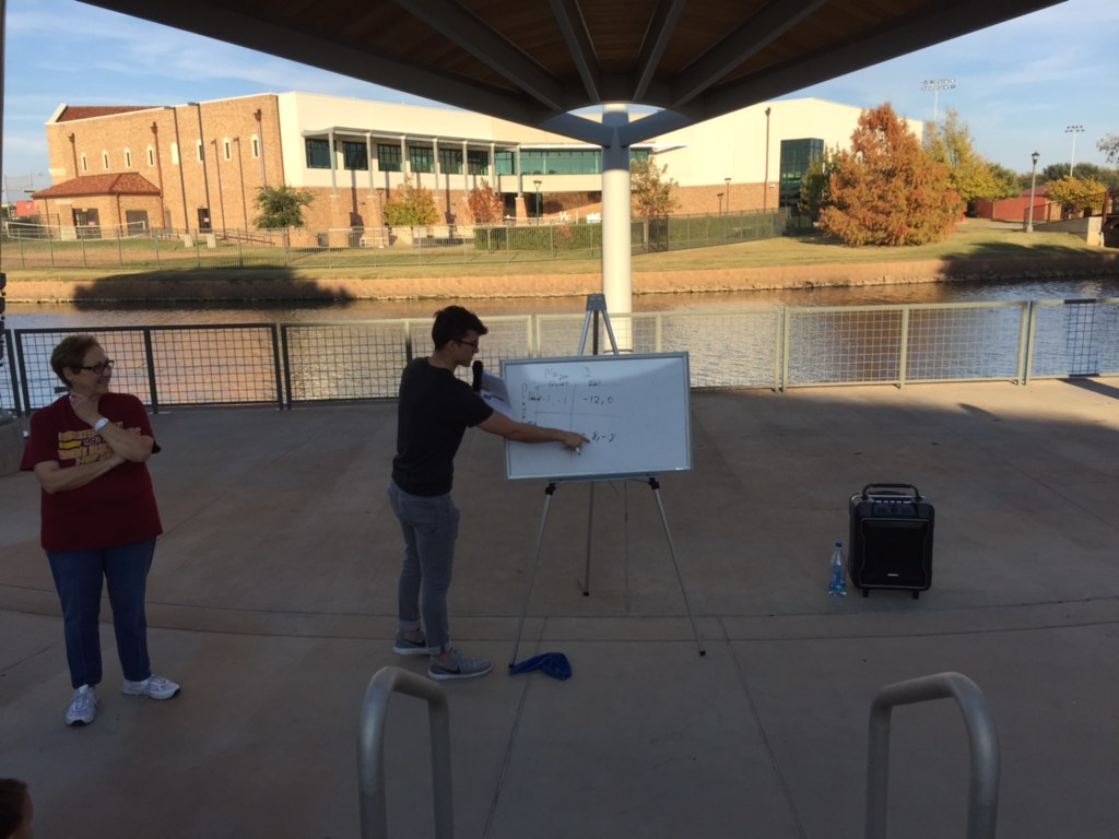 Michael Olaya, mechanical engineering and physics senior, gives presentation at the Science Café. Photo by Chloe Phillips.