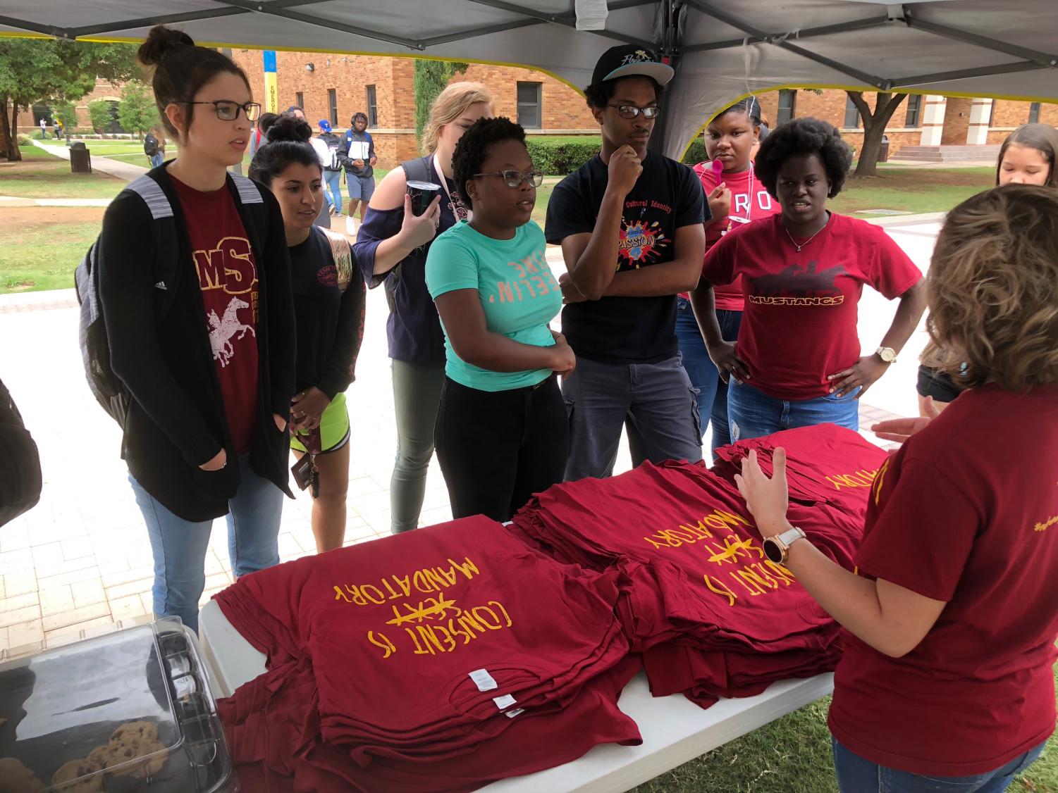 Student wait outside Clark Student Center to get their "Consent is Mandatory" shirt, prompting a discussion of what consent means on Consent Day Sept. 6, 2018. Photo by Bradley Wilson