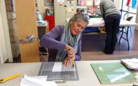 2b. Next your square is ironed flat and then trimmed to be exactly 7 inches across.