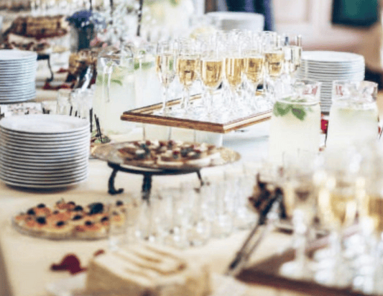 Elegant dessert table with champagne glasses and sweet treats.