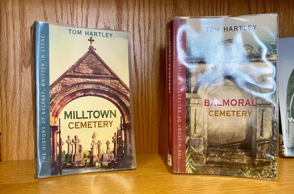 Things Helen Loves, image of two local history books in Linen Hall Library, Belfast. One is a guide to Milltown cemetery, one a guide to Balmoral Cemetery.