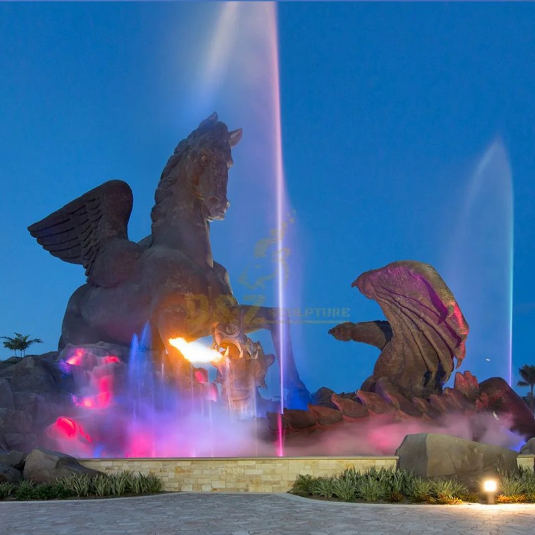 Pegasus and Dragon statue in Hallandale Beach glowing with colorful fountain lights at night