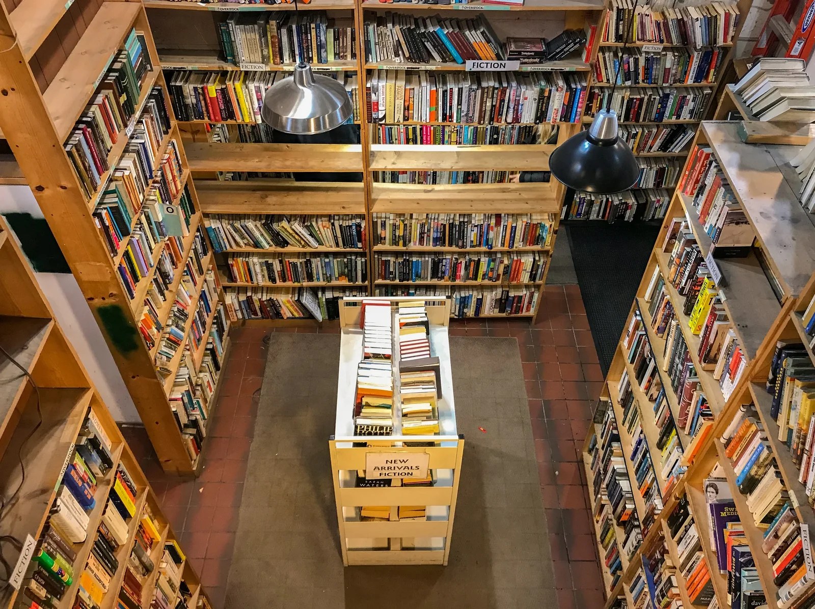 Interior of Myopic Books Chicago with tall wooden bookshelves filled with used books