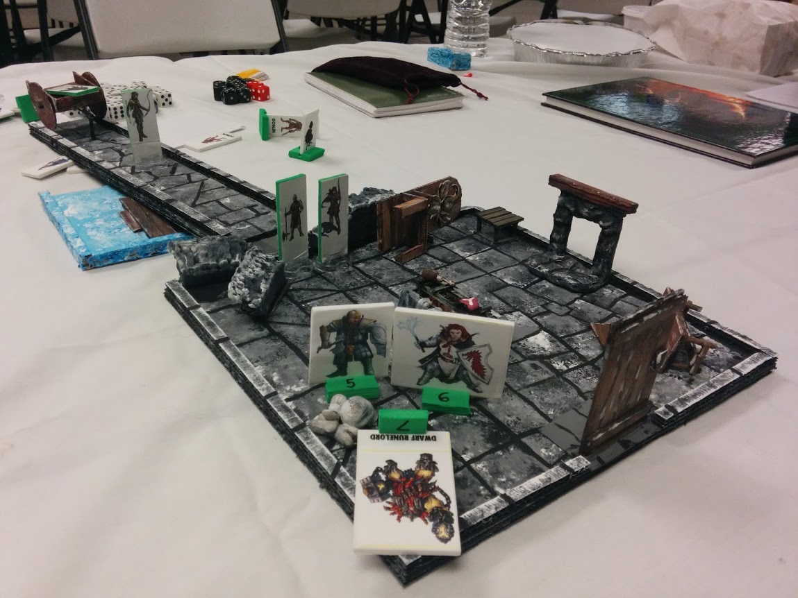 Here's Leg Up's Dwarf (Bran, Left) standing beside a female dwarf NPC as they stand over the dead dwarf king - while the other players hang back in the hall.