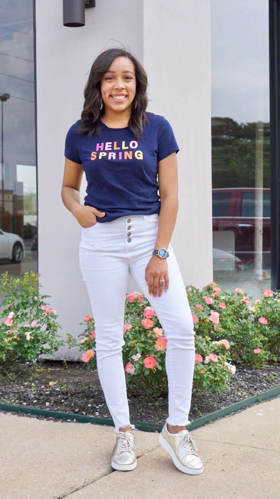 hello spring graphic tee paired white skinny jeans and metallic sneakers